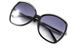 Black fashion sunglasses isolate on white background photo