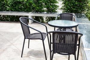 Striped table and wicker armchair photo