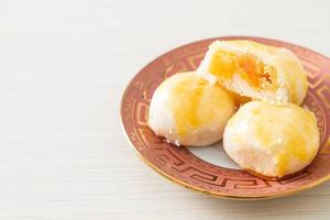 Chinese pastry moon cake with salted egg peanut or Spring Roll pastry with nuts and salted eggs photo