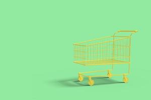 Yellow shop cart on a green background abstract image. Minimal concept shopping business. 3D render. photo