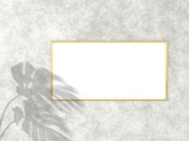 1x2 horizontal Gold frame for photo or picture mockup on concrete background with shadow of monstera leaves. 3D rendering.