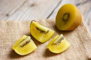 Kiwi slice on sack , Close-up of yellow kiwi fruit photo