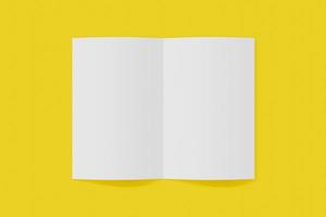 Mockup vertical booklet, brochure, invitation isolated on a yellow background with soft cover and realistic shadow. 3D rendering. photo