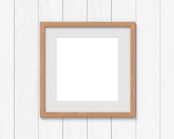 Square wooden frames mockup with a border hanging on the wall. Empty base for picture or text. 3D rendering. photo