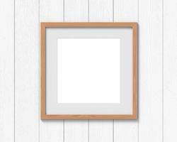 Square wooden frames mockup with a border hanging on the wall. Empty base for picture or text. 3D rendering. photo