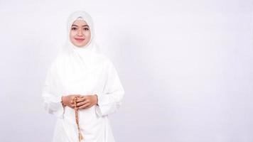 Asian women muslim pray on a white background photo