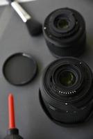 Cleaning photo lenses with a brush and a pear