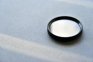 Light filter for a photo lens on a gray background