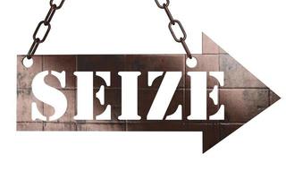 seize word on metal pointer photo