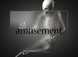 amusement word on glass and skeleton photo