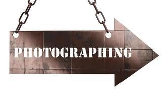 photographing word on metal pointer photo