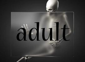 adult word on glass and skeleton photo