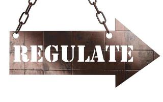 regulate word on metal pointer photo