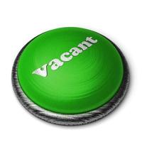 vacant word on green button isolated on white photo
