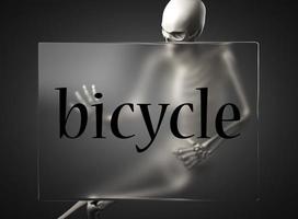 bicycle word on glass and skeleton photo