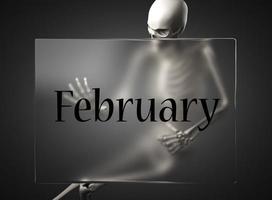 palabra de febrero sobre vidrio y esqueleto foto
