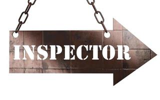 inspector word on metal pointer photo