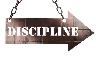 discipline word on metal pointer photo