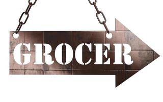 grocer word on metal pointer photo