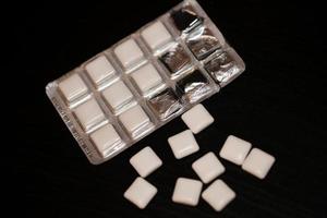 White nicotine square bubble gums close up smoking mania background high quality big size print photo