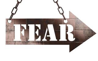 fear word on metal pointer photo