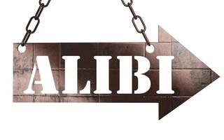 alibi word on metal pointer photo