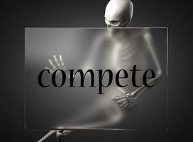compete word on glass and skeleton photo