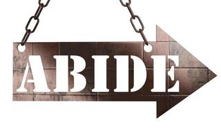 abide word on metal pointer photo