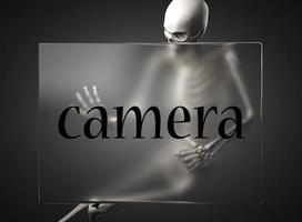 camera word on glass and skeleton photo