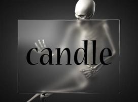 candle word on glass and skeleton photo