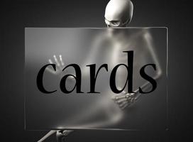 cards word on glass and skeleton photo