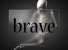 brave word on glass and skeleton photo