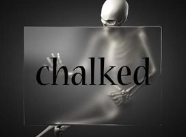 chalked word on glass and skeleton photo