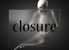 closure word on glass and skeleton photo