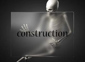 palabra de construcción en vidrio y esqueleto foto