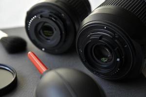 Cleaning photo lenses with a brush and a pear