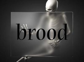 brood word on glass and skeleton photo