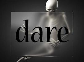 dare word on glass and skeleton photo