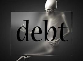 palabra de deuda en vidrio y esqueleto foto
