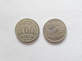 100 Rupiah.  Indonesian old money scattered in the 70s.  Suitable for content related to finance and investment. photo