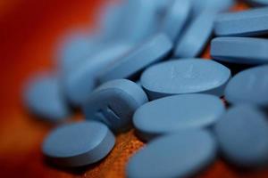 píldoras médicas azules fondo de primer plano impresión de gran tamaño de alta calidad foto