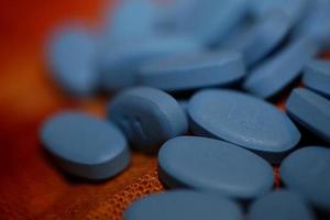 píldoras médicas azules fondo de primer plano impresión de gran tamaño de alta calidad foto