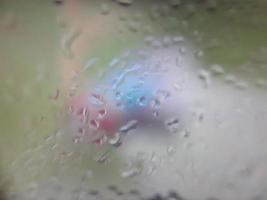 Water drops on window with blur background photo