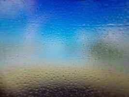 Water drops on window with blur background photo