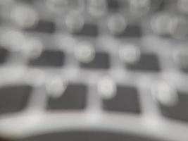 Abstract bokeh background on computer keyboard photo