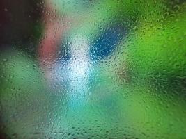 Water drops on window with blur background photo