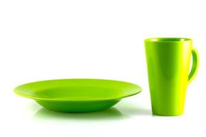 Green dish and green cup isolate on white background photo