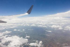 Blue sky with clouds on the airplane photo