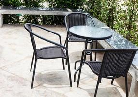 Striped table and wicker armchair photo