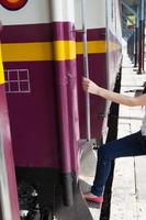 Woman enters train photo